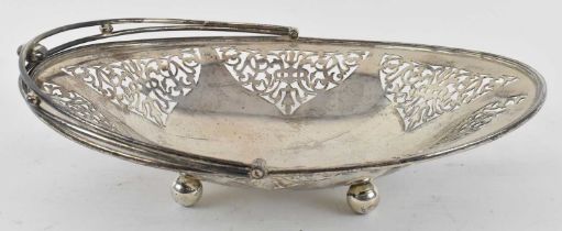 WILLIAM ADAMS LTD; a George V hallmarked silver pierced swing handled basket, Birmingham 1931, width