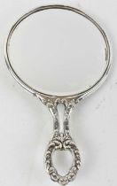 An early 20th century hallmarked silver hand mirror (rubbed marks).