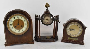 An early 20th century oak eight day mantel clock, with two further mantel clocks (3).