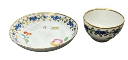 CHELSEA; a gold anchor tea bowl with saucer, painted with fruits, diameter 7.5cm. Condition