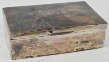 A & J ZIMMERMAN LTD; an Edward VII hallmarked silver cigarette box, Birmingham 1907, engraved with
