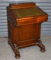 A 19th century oak Davenport desk, with hinged lid and four drawers to the right hand side, width