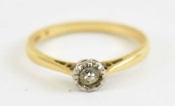 An 18ct yellow gold diamond solitaire ring set with small central diamond, size N, approx 2.3g.
