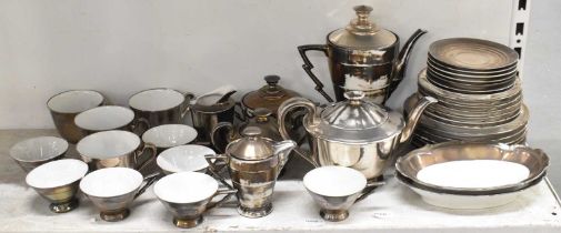 A foreign Art Deco style silvered part tea service comprising seven coffee cups, four teacups,