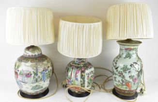 A group of three assorted Chinese Famille Rose table lamps, two fashioned from ginger jars, height