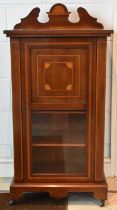 An Edwardian mahogany and satinwood inlaid music cabinet, with single glazed door, width 56cm.