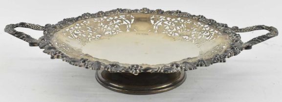 WALKER & HALL; a George V hallmarked silver pierced twin handled circular dish, diameter 31cm, width