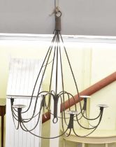 A modern wrought iron grey painted pricket six branch chandelier, height 92cm.