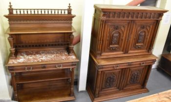 A large 19th century Continental carved walnut cupboard, with two oak lined drawers above a pair