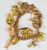 A 9ct yellow gold charm bracelet with charms including an elephant, donkey, bull, articulated