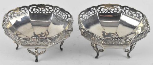 HENRY MATTHEWS; a pair of George V hallmarked silver octagonal pierced silver footed dishes,