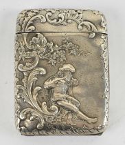 A Victorian hallmarked silver cigarette case, with hinged lid and fall front, decorated with a scene