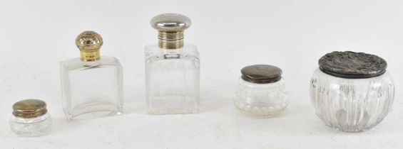 NORMAN MARSHALL; a George V hallmarked silver topped cut glass scent bottle, height 12cm, another