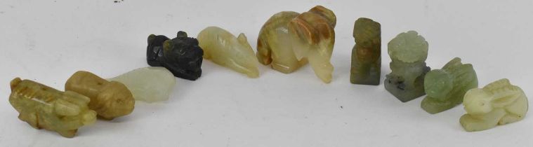 A group of ten Chinese carved hardstone and soapstone figures including a carved hardstone fish,