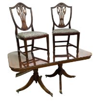 A reproduction twin pedestal dining table, with central leaf, and 6 chairs, top measures 161 x