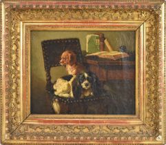 A late 19th century oil on canvas, interior scene depicting two spaniels sitting on a chair, 25 x