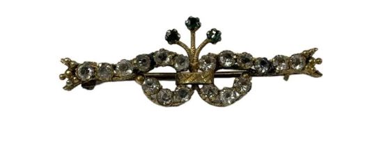 A 9ct yellow gold brooch set with three small emeralds and eighteen small white stones, length 4.