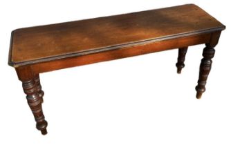 A late 19th/early 20th century mahogany window seat on turned supports, width 91cm.