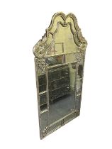 A large Venetian style plate glass wall mirror with silvered frame, height 175cm.