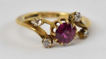 An 18ct yellow gold ruby and diamond ring, set with central ruby approx 0.75ct and four small