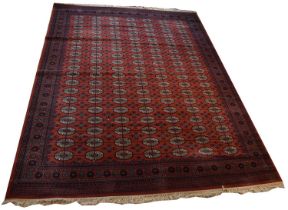 A large red ground Super Kashan Persian design carpet, with geometric pattern, 358 x 274cm.