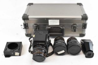 A Zenza Bronica, SQ 6x6 camera with 80mm lens, and a 50mm and 150mm replacement lens and flash,