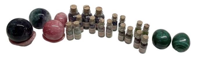 A large quantity of precious stone samples in small glass corked bottles including amethyst,