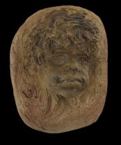 A terracotta wall hanging modelled as a boy's head, indistinctly signed to the reverse, 16 x 13cm.