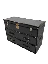 IN THE STYLE OF TIMOTHY OULTON; a modern felt and leather bound travelling trunk/chest of drawers,
