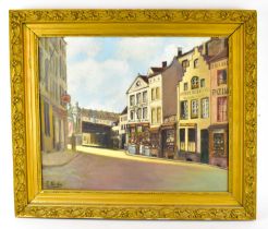 † E NICOLAS; an early 20th century oil on canvas, French street scene, signed lower left, 55 x 45cm,