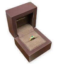 An 18ct yellow gold emerald and diamond set ring, size K/L, approx 3.2g.