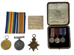 A trio of WWI named medals for 'DVR. H. Mortlock. A.S.C.' and a set of miniature medals.