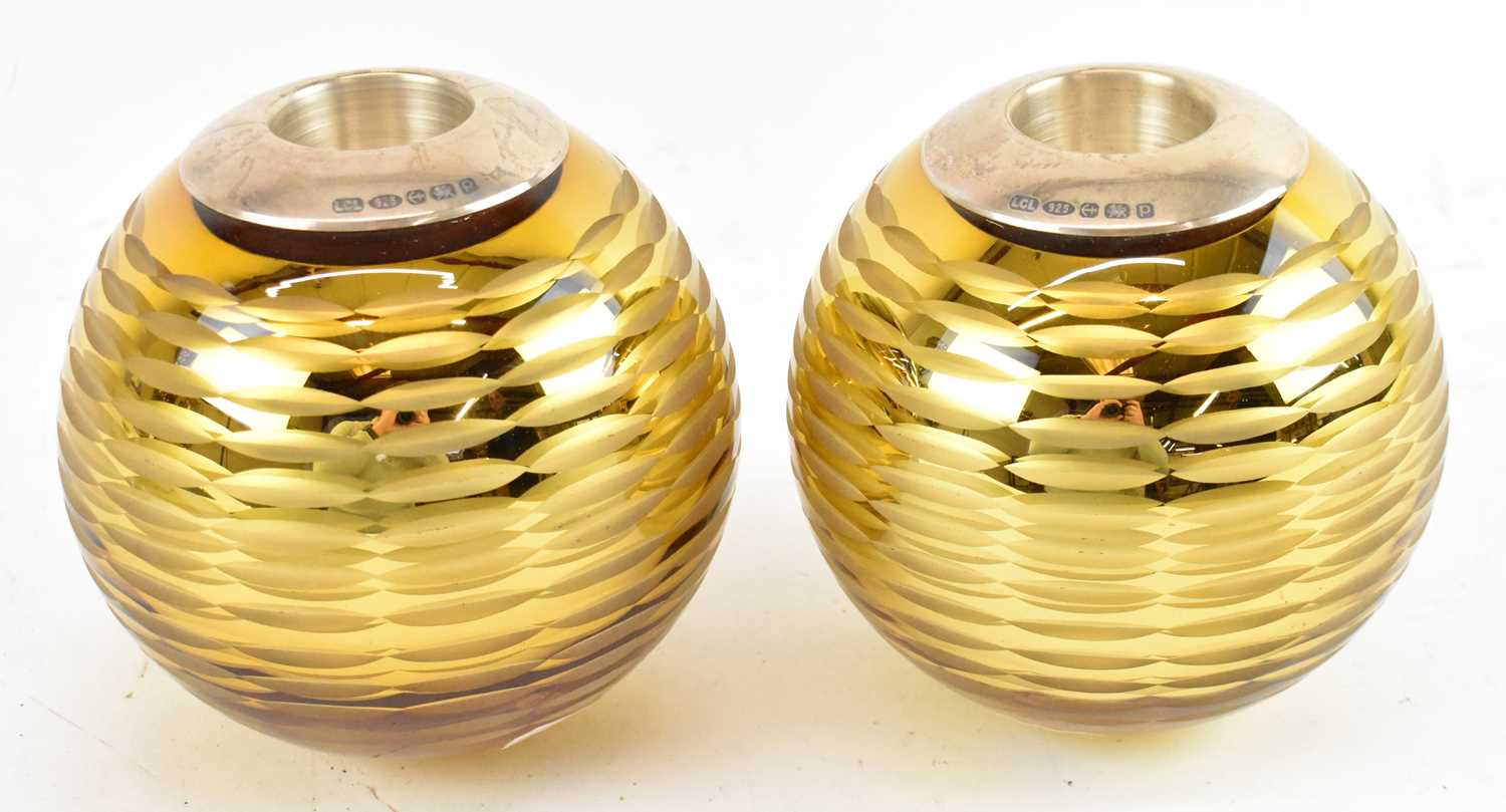 A pair of modern yellow cut glass hallmarked silver mounted candle holders, Birmingham 2014,