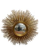 A large reproduction gilt framed sunburst wall mirror, diameter 145cm.