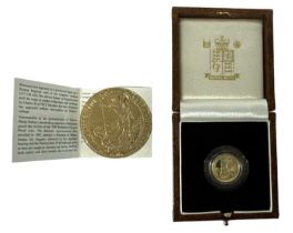 THE ROYAL MINT; a 1999 Britannia gold proof ten pound coin, numbered 711, cased.