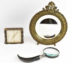 A 19th century gilt metal framed circular easel back mirror, diameter 25cm, a Swiza Mignon red
