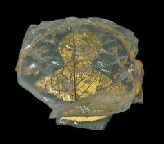 An Ancient Greek style sandwich glass tablet in three fragments, the largest approx 6 x 3cm.