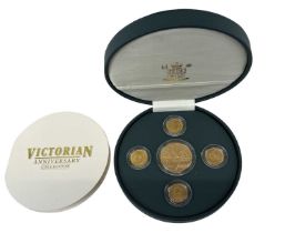 A Victorian Anniversary Collection coin set comprising 1901-2001 five pound gold proof coin, 1869