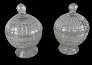 WILLIAM YEOWARD; a pair of circular crystal glass lidded urns, height approx 30cm.