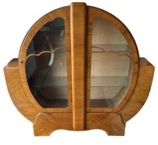 A 1930s Art Deco walnut display cabinet with pair of glazed doors, width 134cm, height 126cm.