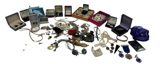 A large quantity of costume jewellery including necklaces, rings, brooches, bangles, etc.