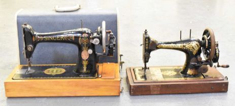 A cased Singer sewing machine and another uncased Singer sewing machine (2).