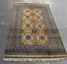 A brown ground Asian style carpet with geometric design, 220 x 125cm.