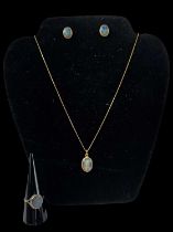 An 18ct yellow gold necklace suspending an 18ct yellow gold opal set pendant, a pair of matching 9ct