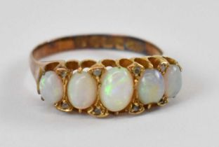 An 18ct yellow gold ring set with five opals, size O, approx 4g.