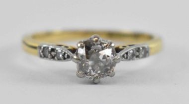An 18ct yellow gold and platinum diamond solitaire ring, the central stone approx 0.5ct, size K,