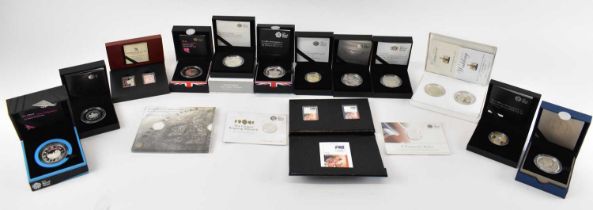 A group of sixteen cased silver proof coins, including The Royal Mint 'A Timeless First', 'The