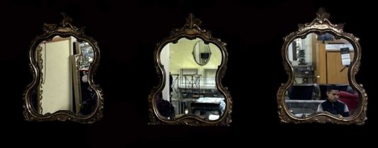A set of three gilt framed wall mirrors, height 66cm.