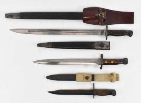 A WWI 1907 Wilkinson Sword Co Lee-Enfield bayonet, overall length 57.5cm, a further Lee-Enfield