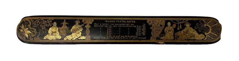 A late 19th century Chinoiserie lacquered postal rates rule, length 25.5cm.